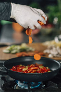 Close-up of chef preparing food in kitchen
