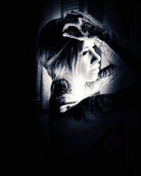 Portrait of young woman in the dark