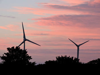 Silhouette of windmill against sky during sunset