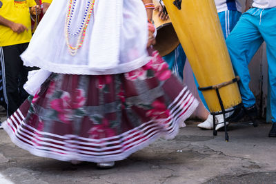 People are seen dancing in a samba circle in the city of cachoeira, bahia.