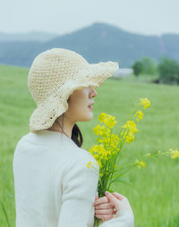 Portrait of young woman wearing hat