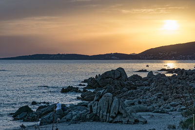 Scenic view of sea against sky at sunset