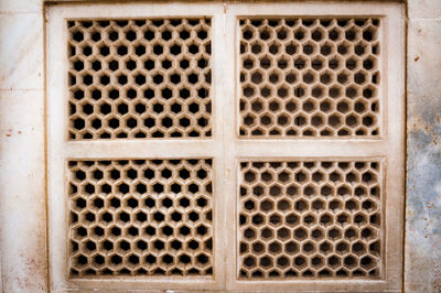 Close-up of metal grate on window