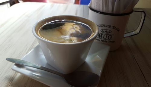 Directly above shot of coffee cup on table