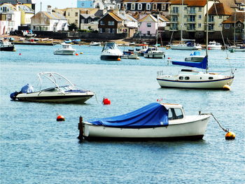 Boats moored at harbor