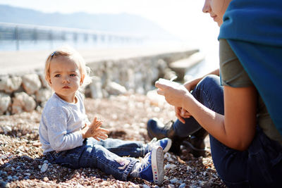 Side view of boy using mobile phone