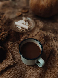 High angle view of coffee cup on table