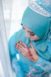 High angle view of bride in traditional clothing