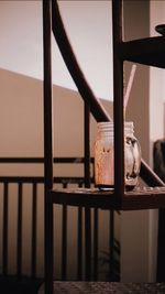 Close-up of glass jar on shelf