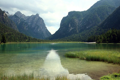 Scenic view of lake and mountains against sky