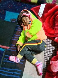 High angle view of cute girl sitting in bus