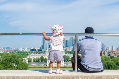 A father and child spending quality time at greenwich park in summer, london