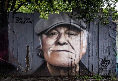 Portrait of man wearing sunglasses against trees