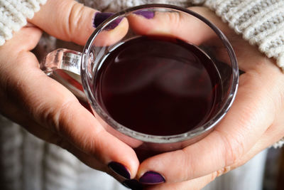 Close-up of hand holding drink