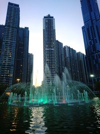 View of fountain with buildings in background