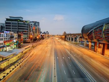 Panoramic view of city street against sky