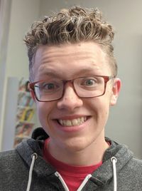 Close-up portrait of smiling young man