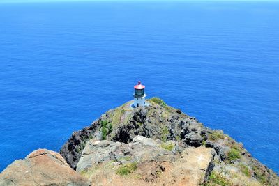 High angle view of lighthouse on cliff against sea at hawaii islands