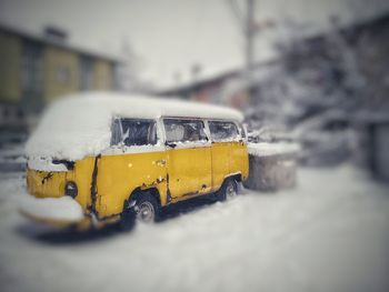 Yellow car on street during winter