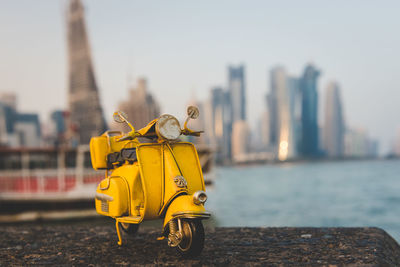 Yellow vintage car against building