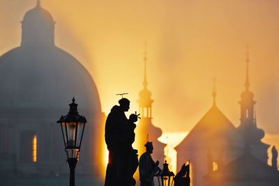 Rear view of man standing in front of church