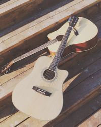 High angle view of guitar on table