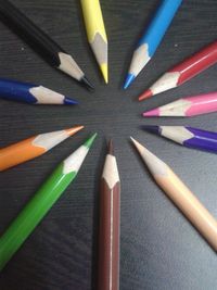 High angle view of multi colored pencils on table