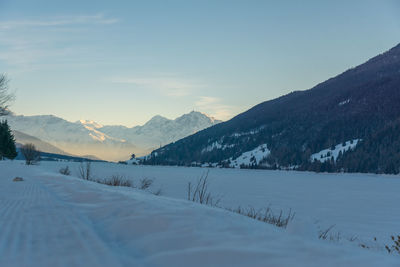 Scenic view of mountains against sky during winter