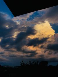 Low angle view of silhouette trees against sky during sunset