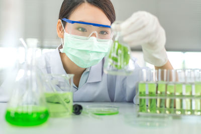 Female scientist experimenting in laboratory