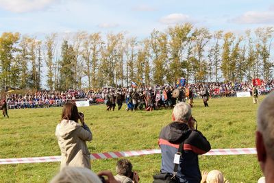 People on field against sky