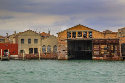 View of buildings against cloudy sky