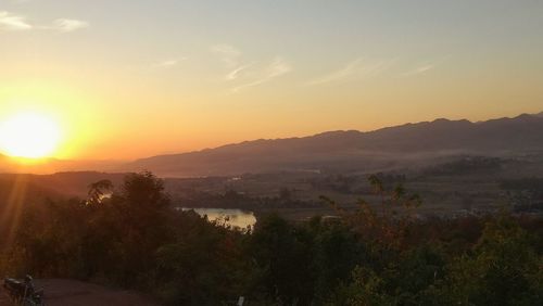 Scenic view of mountains against sky during sunset