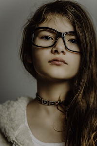 Close-up portrait of girl in eyeglasses