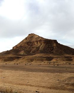 Rock formations in desert against sky