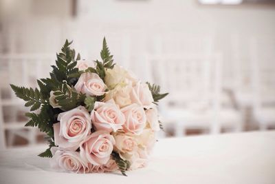 Bouquet of roses on table at wedding