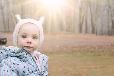 Portrait of cute girl in warm clothing during winter