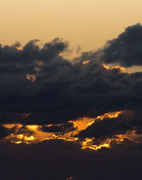 Low angle view of cloudy sky at sunset