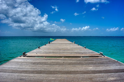 Pier over sea against sky