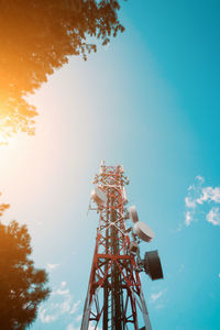 Low angle view of communications tower against sky