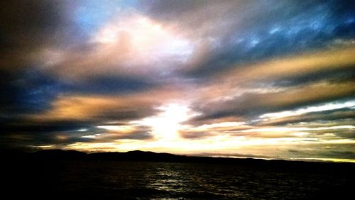 Scenic view of sea against cloudy sky