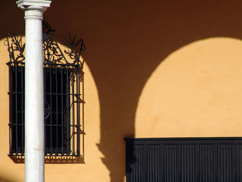 Metal gate against building