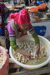 Woman in market stall