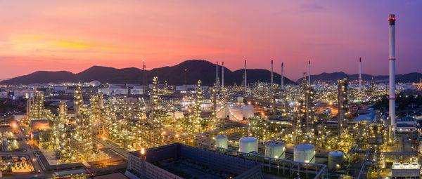 High angle view of illuminated buildings against sky at sunset
