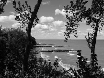 Scenic view of sea against cloudy sky