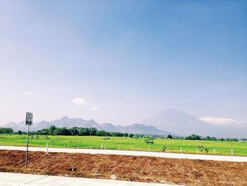 Scenic view of landscape against cloudy sky