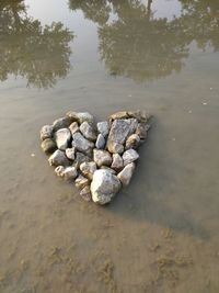 Pebbles on beach against sky