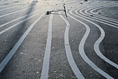 Fallen push scooter on road