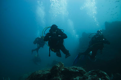 People swimming in sea