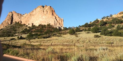 Scenic view of rocky mountains against clear sky